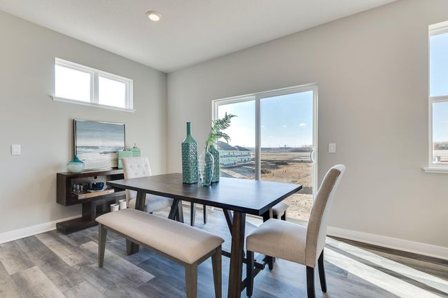 Informal dining with room for a buffet. Photo is of a previously built model home, finishes and selections will vary. | Image 8