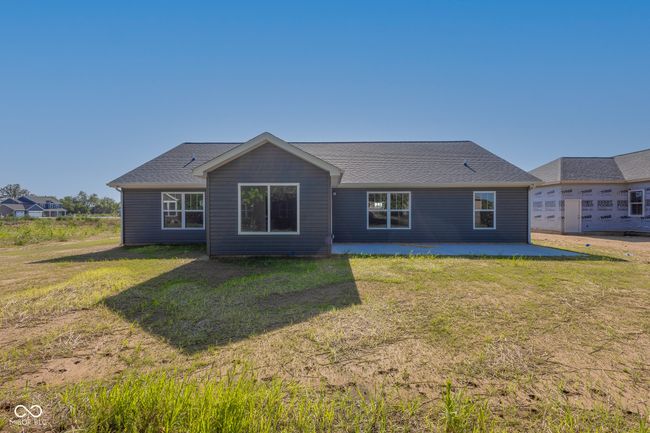 rear view of house with a patio and a yard | Image 5