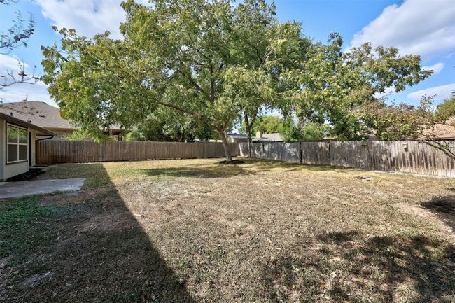View of fenced backyard | Image 33