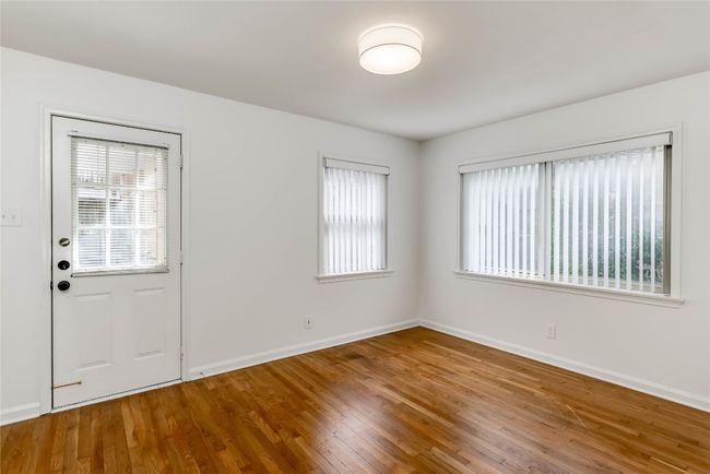 Unfurnished room with wood finished floors and baseboards | Image 25