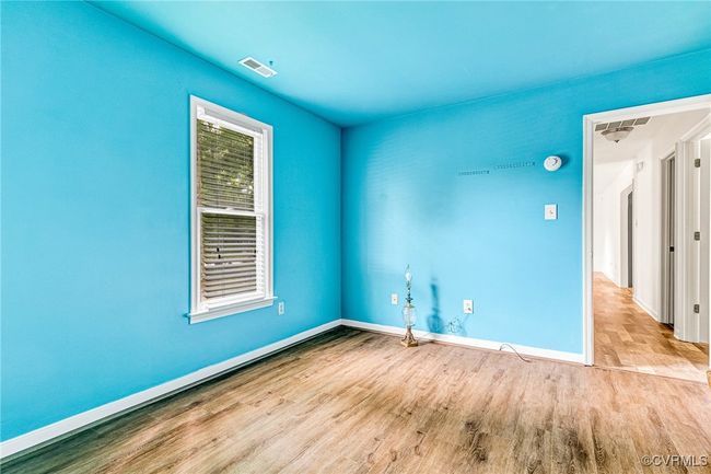 Unfurnished room featuring wood finished floors and baseboards | Image 17
