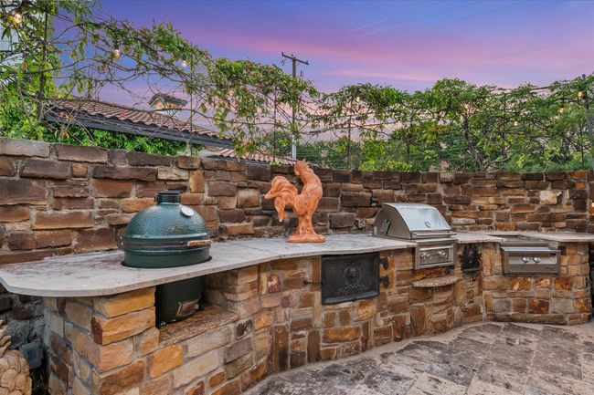 Outdoor kitchen complete with Green Egg, Grill, and gas burner perfect for seafood boils | Image 37