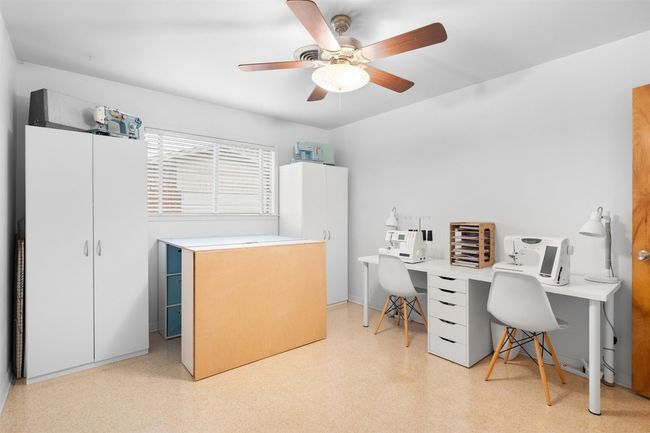 Office area featuring light floors and a ceiling fan | Image 33