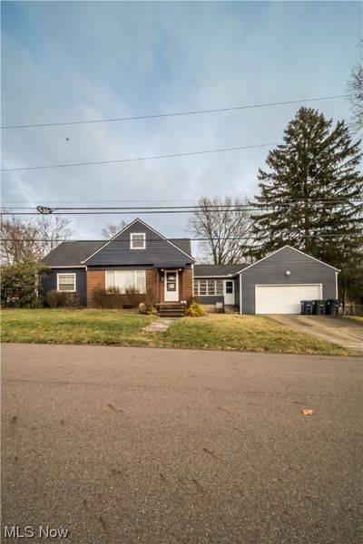 View of front of house with a garage and a front lawn | Image 3