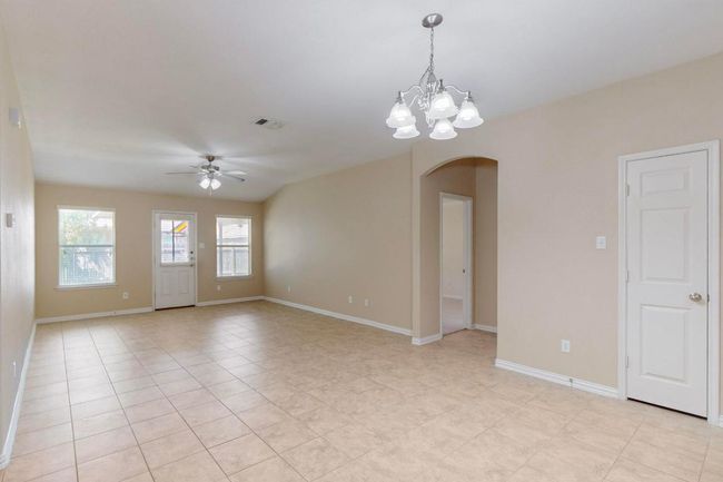 The open floorplan makes this space feel even larger. The large tile flooring is a neutral color and easy to work with. | Image 19