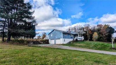 View of side of property with a garage and a yard | Image 3