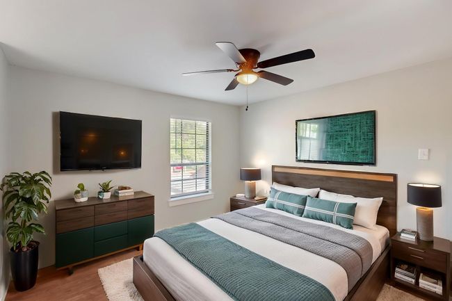 Bedroom featuring wood finished floors and a ceiling fan | Image 18