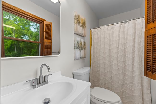 Primary bathroom was just refreshed with new vanity, toilet, mirrot and lighting | Image 14