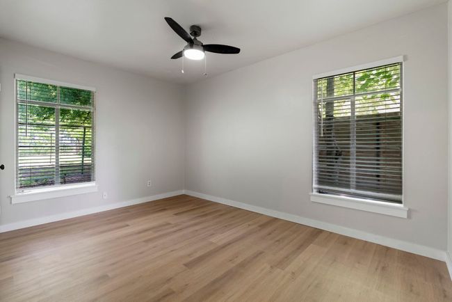 Another nice-sized bedroom with great natural light and a high ceiling. | Image 17