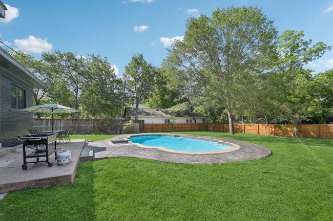 View of pool featuring a patio | Image 37