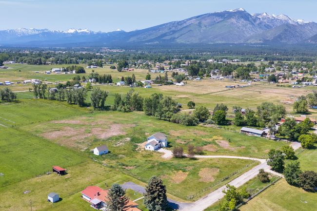 Aerial view of sparsely populated area with a mountainous background | Image 60