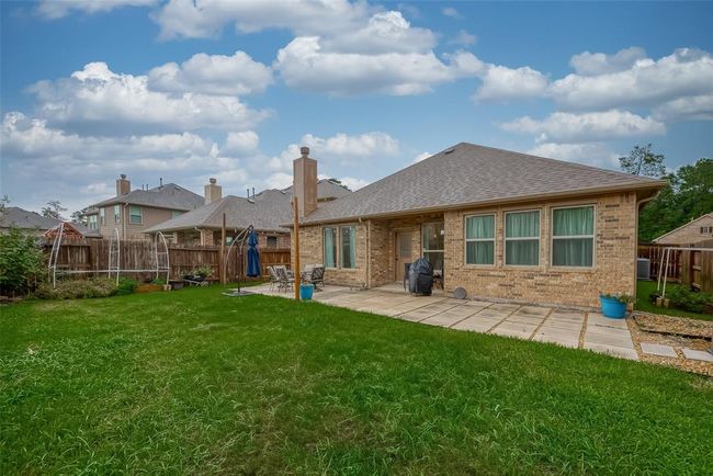 Back of home is brick with loads of windows | Image 39