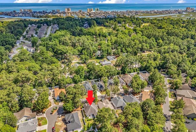 Aerial view of residential area with a nearby body of water | Image 30