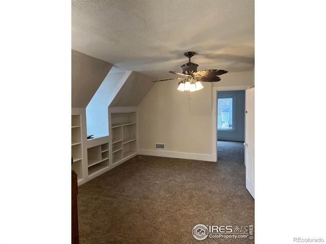 Open Rec. room with built in shelving. | Image 12