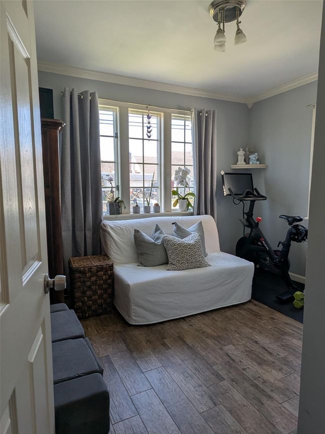 Bedroom or office with washer/dryer in the closet | Image 16