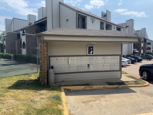View of home's community featuring mail area and uncovered parking | Image 17