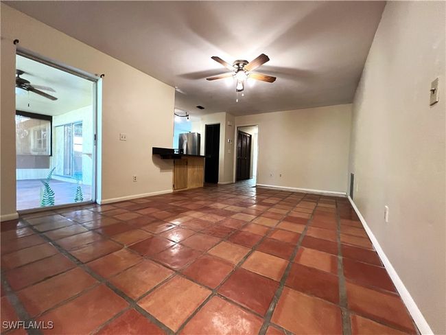 Unfurnished bedroom with ceiling fan, light wood-type flooring, and a closet | Image 16