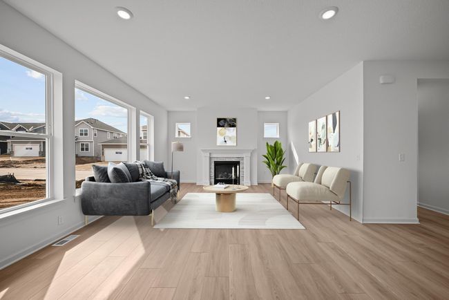 The living room, which occupies 20'x15', offers 9' ceilings and oversized windows. | Image 4