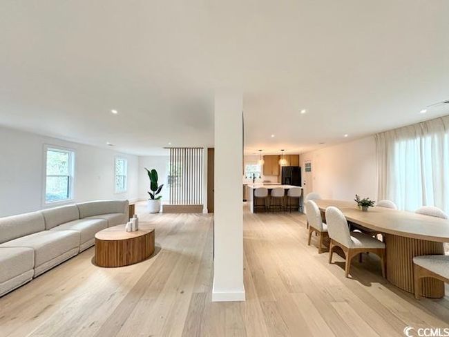 Living area featuring light wood-style floors and recessed lighting | Image 6
