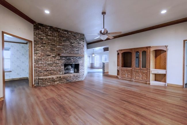 Huge living room open to wet bar, game room. kitchen and breakfast nook. | Image 6