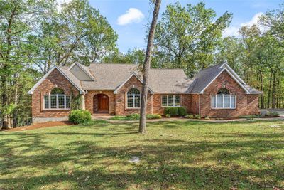 View of front facade with a front lawn | Image 1