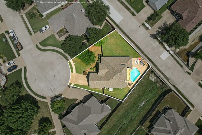Aerial view of property's location featuring property parcel outlined and a pool | Image 32