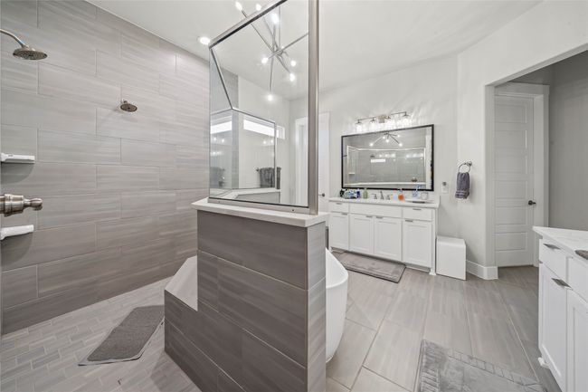 Elegant tile. Be bench. 2 shower heads. Walk thru. | Image 17