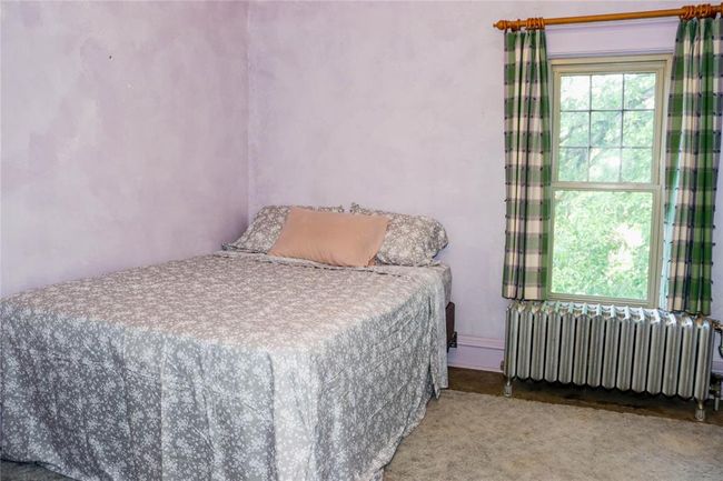 A 2nd Bedroom , with the doorway leading to third floor | Image 30