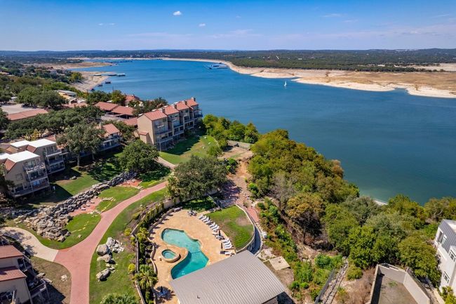 Bird's eye view of a large body of water and a pool area | Image 31