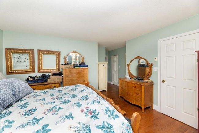 Bedroom featuring wood finished floors | Image 21