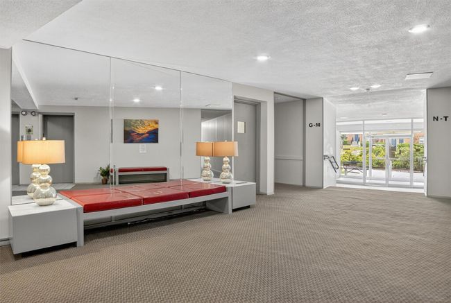 Building lobby featuring a textured ceiling and recessed lighting | Image 4