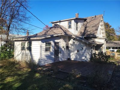 Back of house with a wooden deck | Image 3