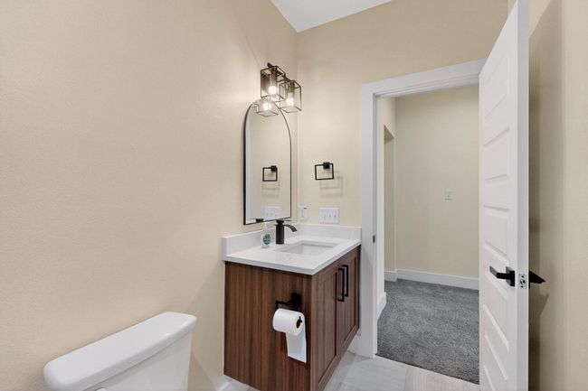 Bathroom featuring toilet and vanity | Image 27
