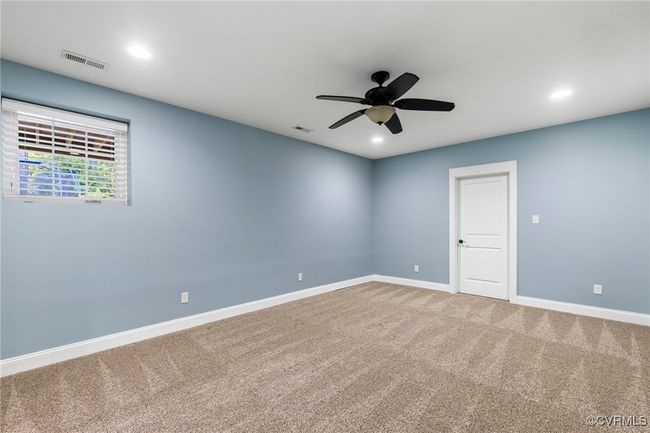Carpeted spare room featuring ceiling fan and recessed lighting | Image 40