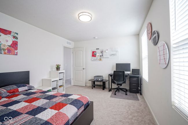 carpeted bedroom with baseboards and visible vents | Image 34