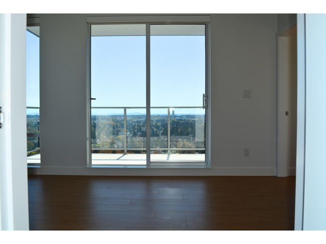 Spare room featuring baseboards, a healthy amount of sunlight, and wood finished floors | Image 12