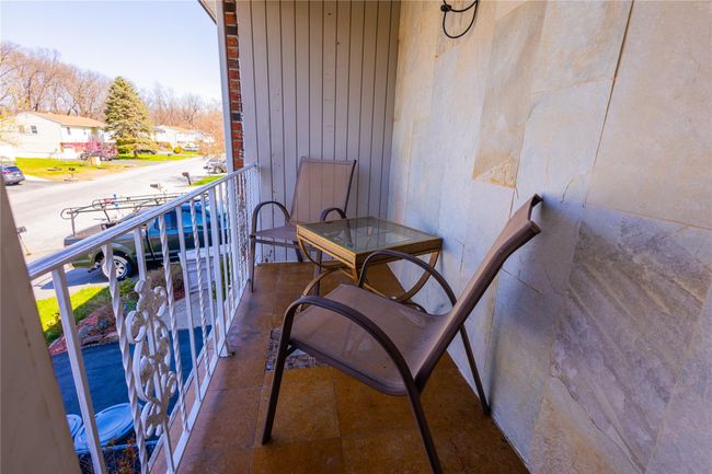 Balcony featuring a porch and a residential view | Image 14