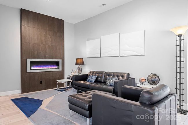 Modern Family Room with custom ethanol fireplace and surround. | Image 14