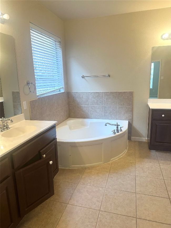 Bathroom featuring vanity, a garden tub, and tile patterned floors | Image 15