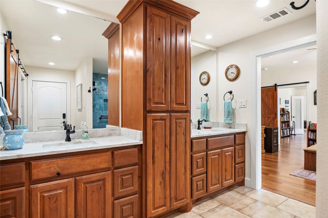 Dual sinks and granite countertops with plenty of storage | Image 17