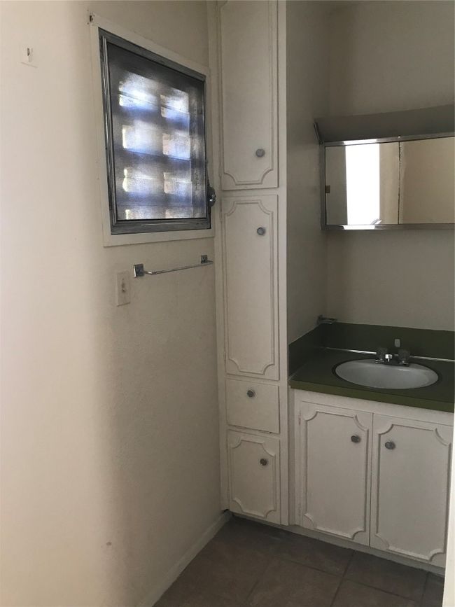 Bathroom with vanity and tile patterned floors | Image 6