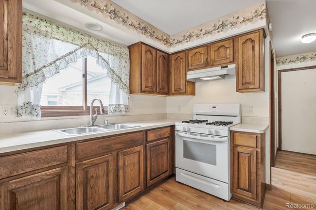 Laundry & garage are conveniently located | Image 11