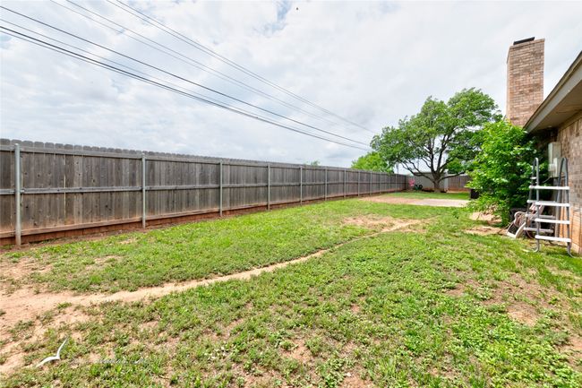 View of yard with a fenced backyard | Image 26