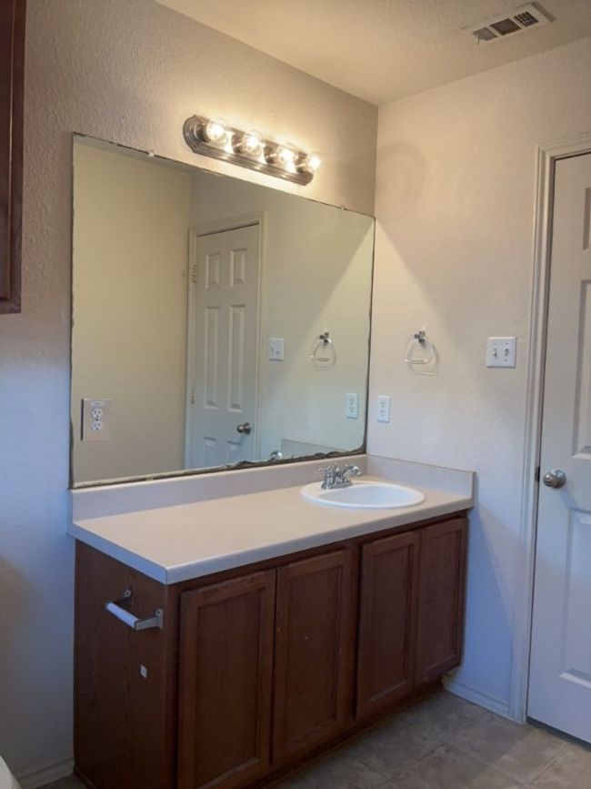 Bathroom featuring vanity and tile patterned floors | Image 14