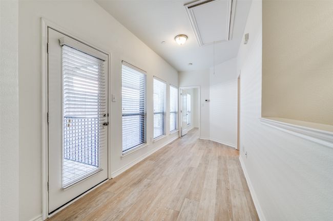 This flexible space offers endless possibilities—ideal for a home office, workout area, or reading nook. Bright and open, it features direct access to a private balcony, blending indoor comfort with outdoor relaxation. A perfect extension of your living area with room to make it your own. | Image 21