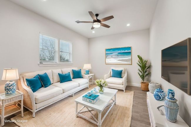 Virtually Staged Living area with recessed lighting, wood plank tile floor, baseboards, and ceiling fan | Image 8