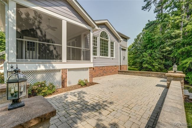 Custom stone patio with integrated outdoor lighting—an inviting space for gatherings or quiet moments outdoors. | Image 44