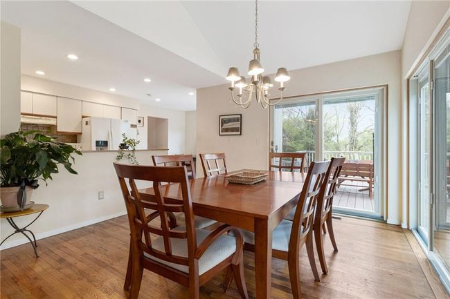 Dining room with 2 sliders to deck | Image 17