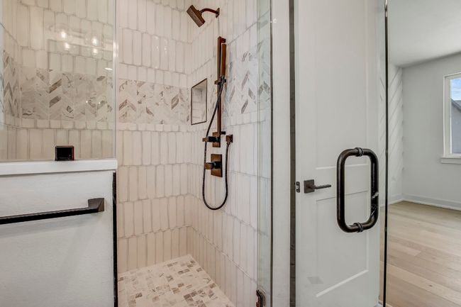 Full bathroom with tiled shower and wood finished floors | Image 18