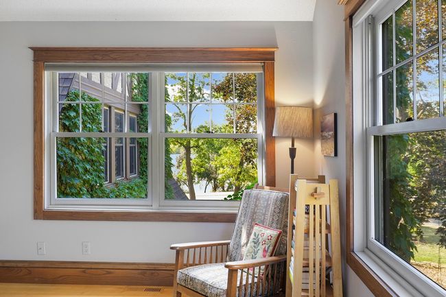 Reading area in primary bedroom offers relaxing views of the Lake. | Image 19